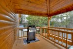 Lower level porch with the hot tub